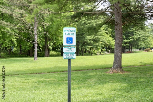 A handicap parking sign in the park.