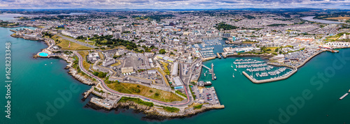 Aerial view of Plymouth Hoe and Royal Citadel along the waterfront in Plymouth, England, with cityscape and marina in the background
