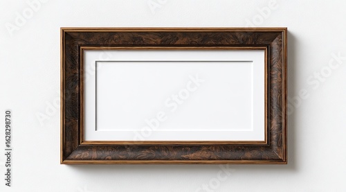 Empty, ornate, brown wooden picture frame