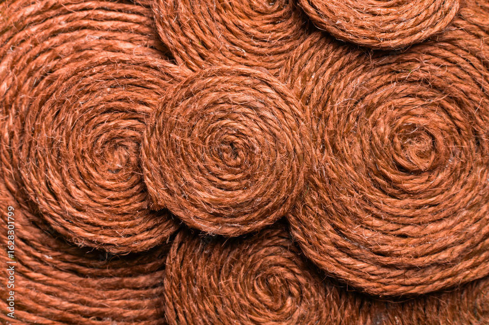Fototapeta premium Texture of red background. Abstract fabric texture or pattern, close-up of orange thread, macro shot of textile surface, wallpaper template for banner, website, background, poster