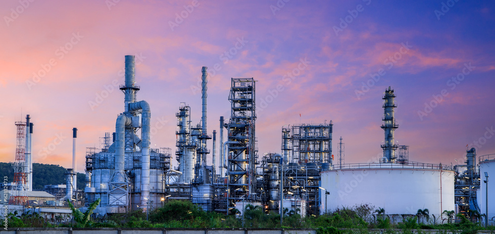 Fototapeta premium Oil and Gas Industrial zone,The equipment of oil refining,Close-up of industrial pipelines of an oil-refinery plant,Detail of oil pipeline with valves in large oil refinery.