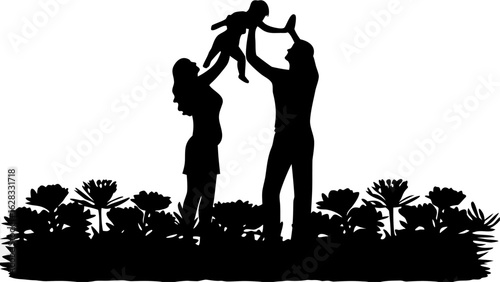 Silhouette of a family with a mother father and child playing in a field of flowers together happily