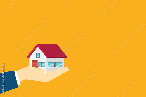Hand holding house