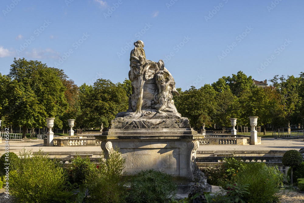 Obraz premium The Nymphaeum or Nymphée in the gardens of the Jardins de la Fontaine in the centre of the old Roman town of Nimes in the Gard region of France