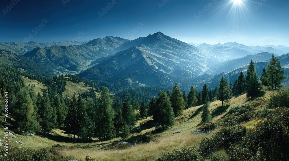 Obraz premium Panoramic alpine vista. Lush green hills, forests, and mountains under a vibrant blue sky with a bright sun