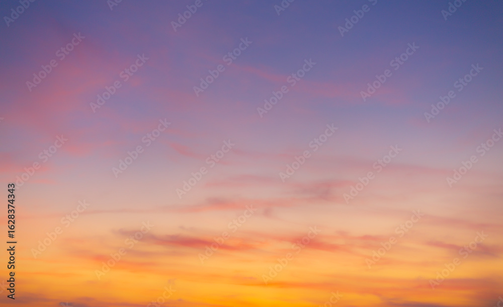 Obraz premium Colorful sky and clouds backdrop in the morning,Beautiful Vivid sky painted by the sun leaving bright golden shades.