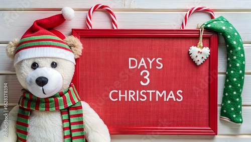 Photo of a cute teddy bear wearing a santa hat and scarf sits next to a red christmas countdown sign showing 3 days until christmas, set against a rustic wooden background