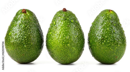 Three avocados, bright green, covered in water droplets, arranged in a horizontal row against a plain white background