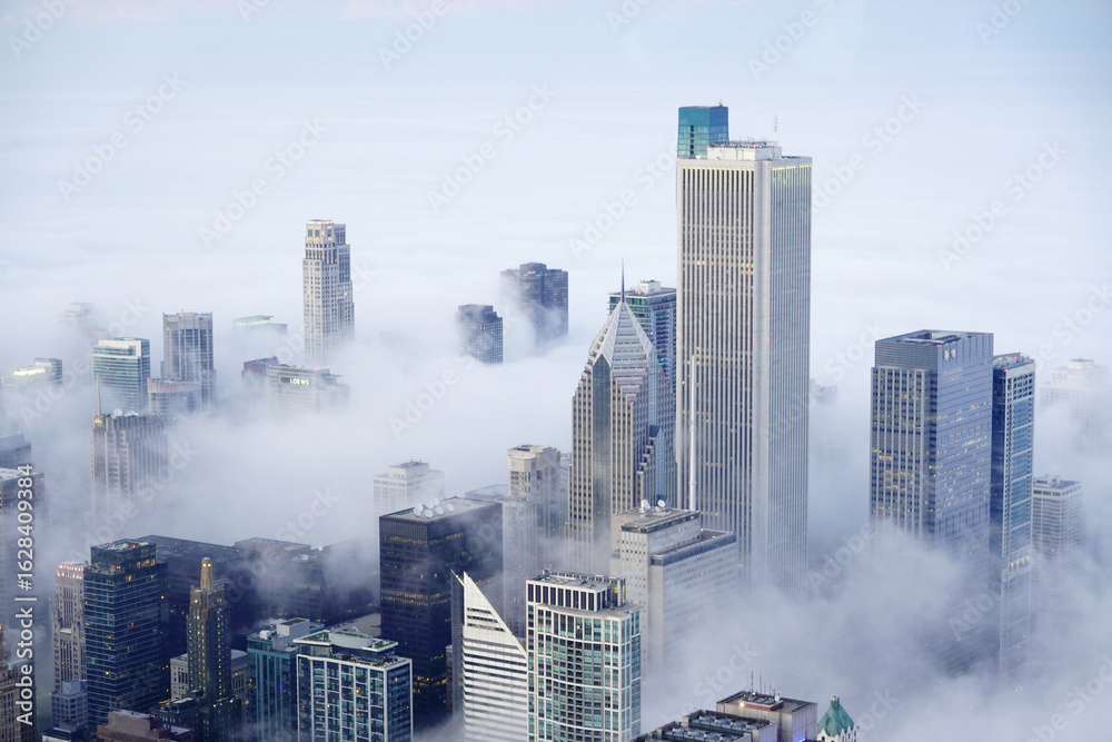Fototapeta premium View from Willis Tower or Sears Building in Chicago with Fog Clouds Rolling in on the City Buildings