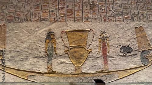 Ancient egyptian tomb painting showing two figures and a vase