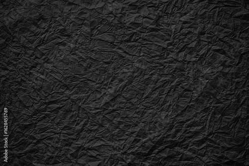 black crumpled paper backgr...