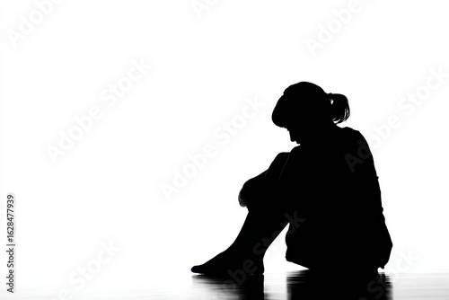 Outline of a Distressed Woman Crouched in a Corner, Expressing Sadness in Isolation