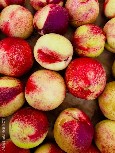 fresh whole ripe white freestone peaches at farmers market 