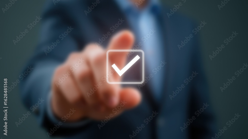 Hand pressing a checkmark button, symbolizing decision-making and affirmation. Hand pressing a checkmark button, symbolizing decision-making and affirmation.
