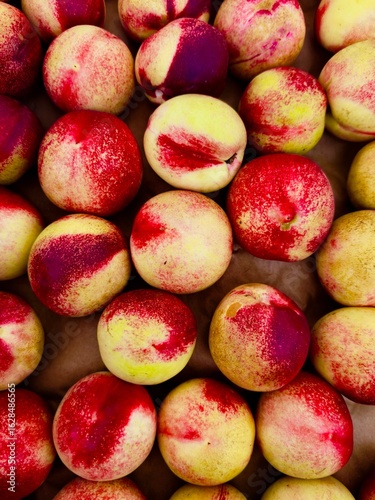 fresh whole ripe freestone white peaches at farmers market 
