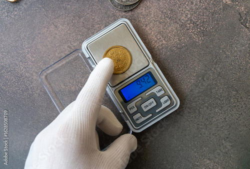 Weigh an antique gold coin on a scale.Find out the price per gram of gold.Take the jewelry to the store.
