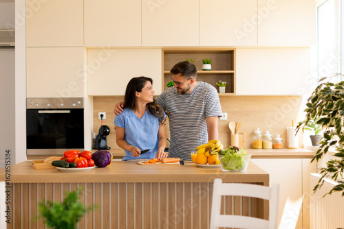 Couple cooks together in a ...