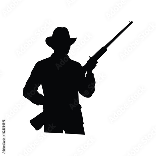 Silhouette of a cowboy with a rifle, ready for action or hunting