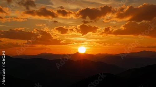 Sunset light shimmering on dusty lens over mountain landscape  