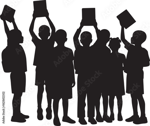 Group of children holding books up in celebration silhouette