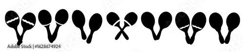 Silhouette of musical instruments maracas in various positions over white background