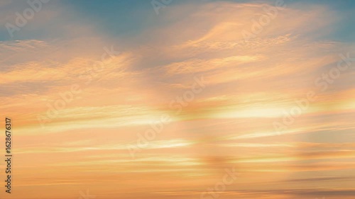 Sky's Pastel Canvas: Soft pastel hues paint the sky, forming an ethereal scene of clouds dancing at sunset or sunrise. This image exudes tranquility and showcases nature's artistry.