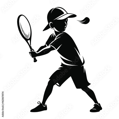 Young boy in silhouette playing tennis and hitting the ball with a racket