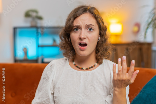 Obraz na plátně Young woman feeling hopelessness and loneliness, nervous breakdown, loses play game becoming surprised by lottery results, bad fortune, loss, unlucky news