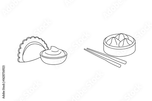 Dumplings and dipping sauce with chopsticks asian food