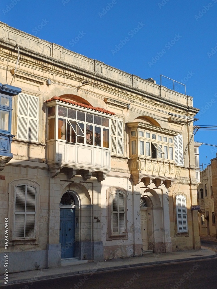 Naklejka premium Picturesque narrow street of medieval town in Rabat, Malta