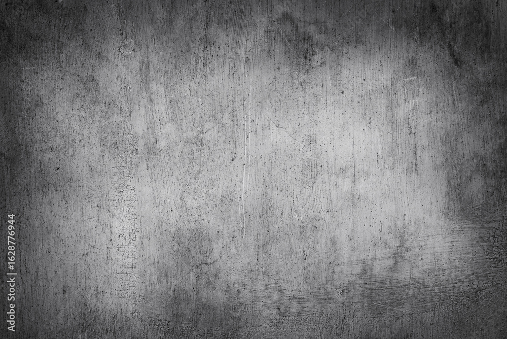 Obraz premium Dark grey grunge wall texture. Abstract background of dark, heavily textured surface reminiscent of old concrete, plaster or metal.