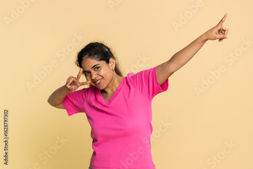 Slika na platnu Indian woman energetically dances to music, joyfully imagining herself performing on stage