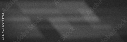 Abstract monochrome grey grainy background with soft gradient transitions