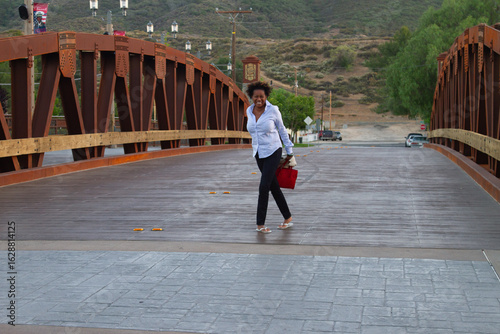 Black Model with Red Purse on Temecula Main Bridge