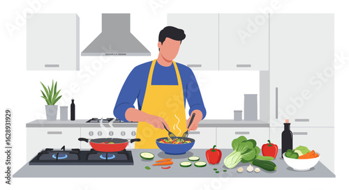 Man in Yellow Apron Tossing Salad with Forks in Kitchen