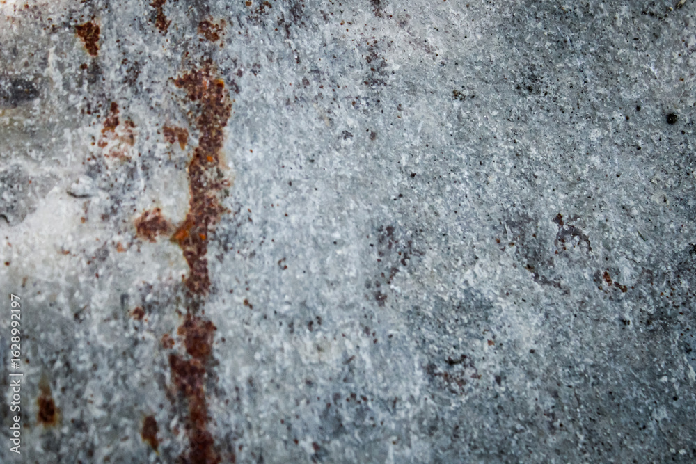 Fototapeta premium weathered textured surface with distressed metal or concrete look. rusty details with antique aesthetic. abstract background with copy space.