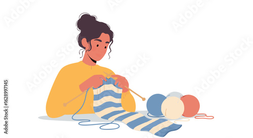 Focused woman knitting a striped scarf with yarn balls in a cozy atmosphere reflecting a calming handmade hobby and creative expression