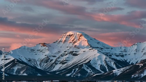Sunrise over snow-capped mountain range