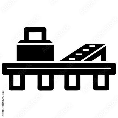 Simple black and white icon representing a factory or industrial building with a ramp and smokestack