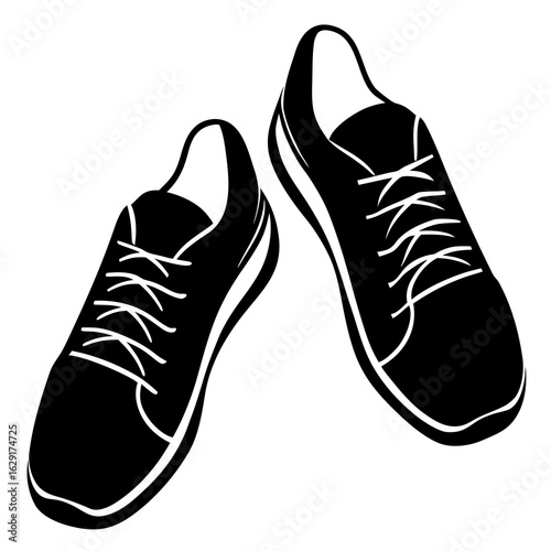 A pair of black athletic running shoes with white laces and soles isolated on a white background