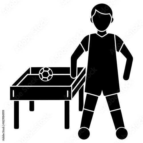 Stylized black silhouette of a smiling boy standing next to a table football game with a soccer ball