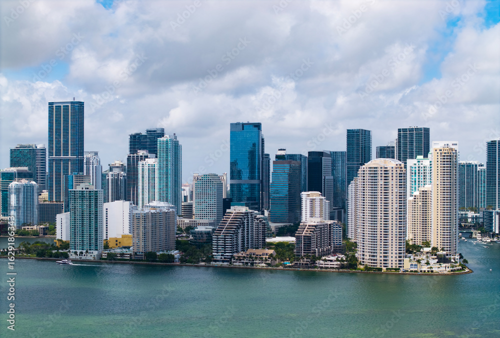 Fototapeta premium Aerial view of Brickell skyline in downtown Miami. Modern skyscrapers rise above Biscayne Bay. Scenic panorama of Miamis financial district.
