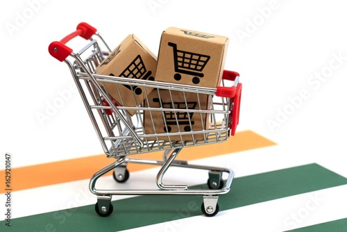 Miniature shopping cart filled with cardboard boxes featuring shopping cart icons