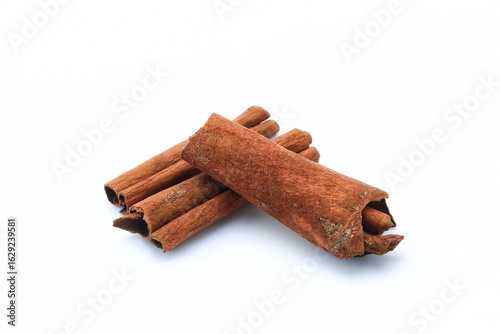 Quadro su tela Brown cinnamon on an isolated white background