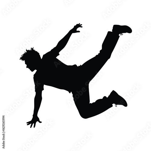 Silhouette of a dancer performing a challenging and dynamic breakdance move