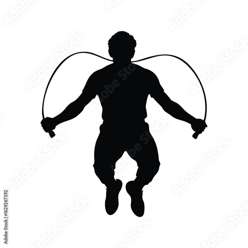 Silhouette of a man jumping rope in midair for fitness training