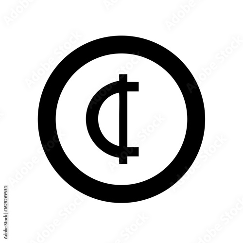 Close up of a black cat with bright green eyes looking directly at the camera in a dimly lit room