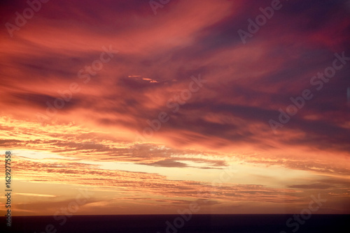 the sky is glowing red and orange