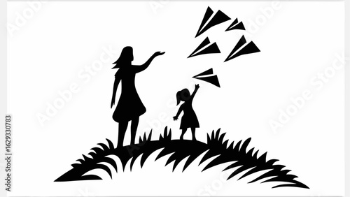 Silhouette of mother and child on grassy hill releasing paper airplanes into the air together happily