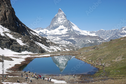 Mt. Matterhorn reflected upside down on lake Riffelsee at Zermatt SWISS in midsummer season / 盛夏のリッフェル湖面に写る逆さマッターホルン＠スイス ツェルマット(湖畔からの標準撮り)